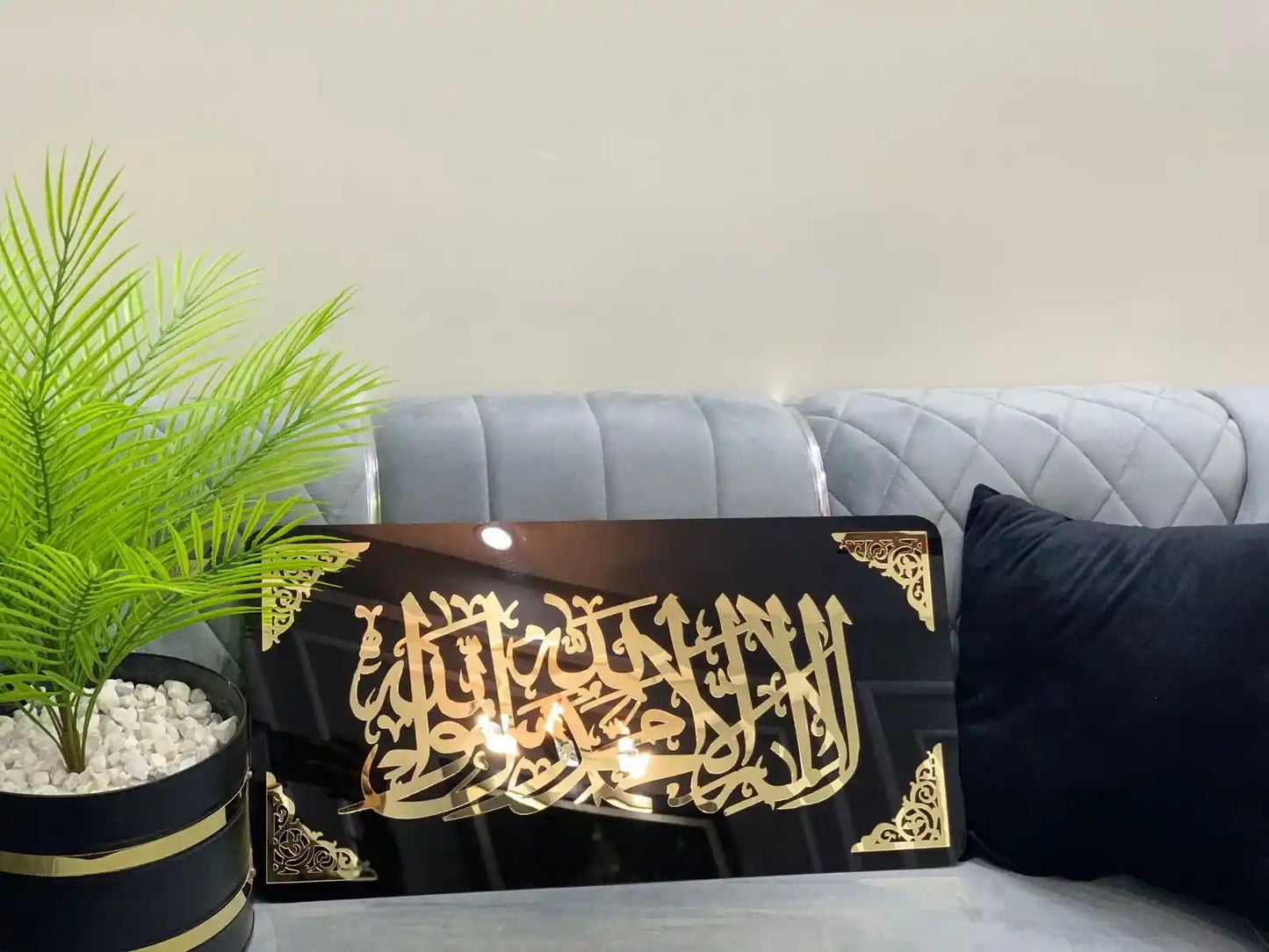 Decorative wall art with Arabic Gold Kalima Tayyaba calligraphy.